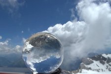 ball-glass-ball-globe-clouds-sky-mountains-transparent-mirroring-mirrored.jpg
